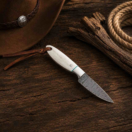 Western-style Buckaroo fixed blade knife crafted from Damascus steel with a polished camel bone handle