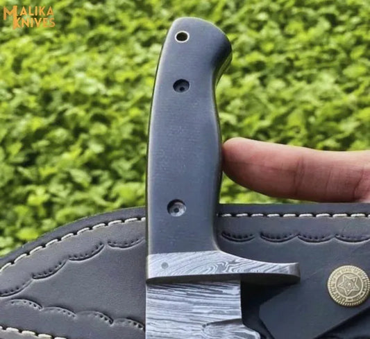 Fire pattern Damascus hunting knife with G10 handle outdoor setup