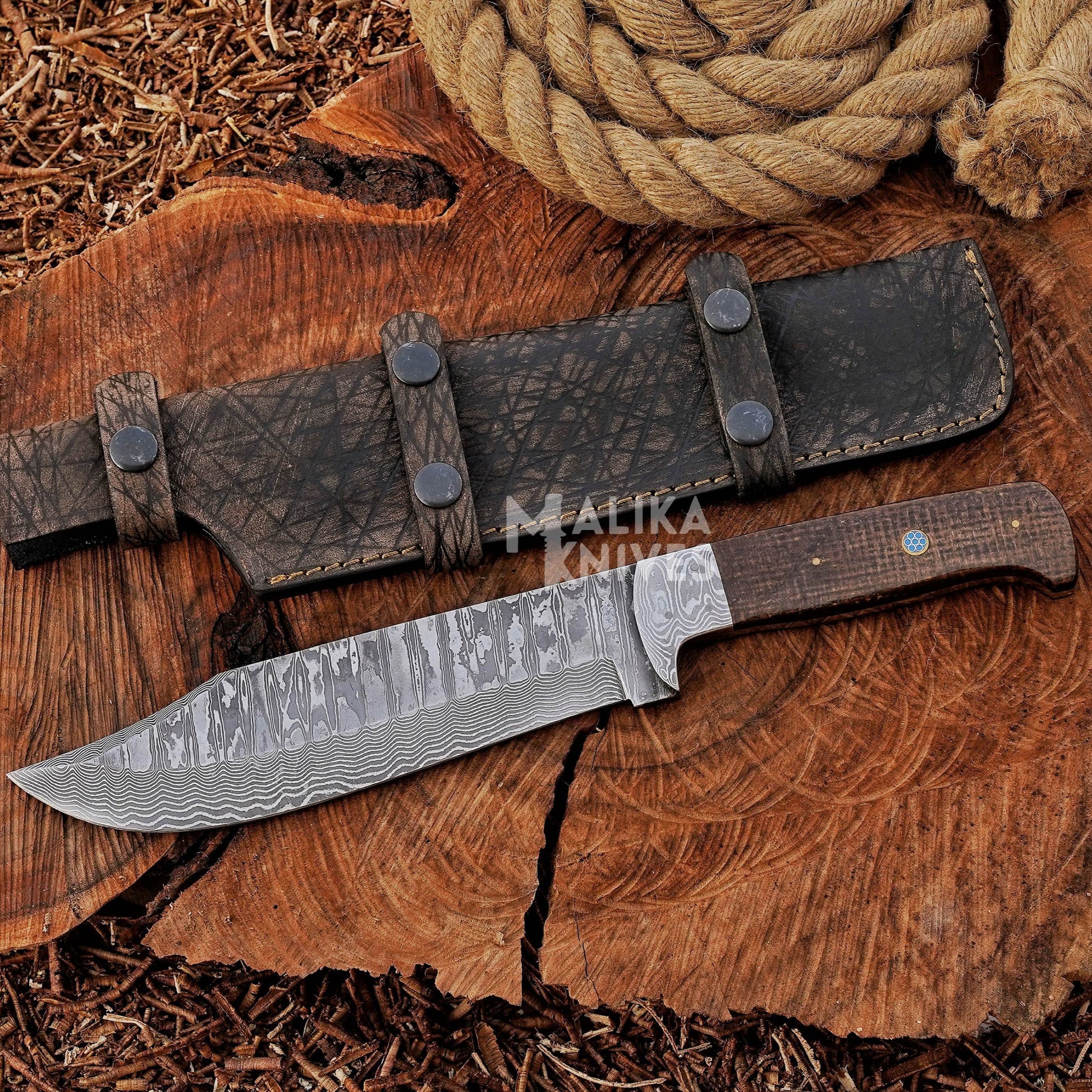 Hunting knife with stainless Damascus steel blade, brown micarta handle, and full tang design, ideal for deer hunting and skinning.