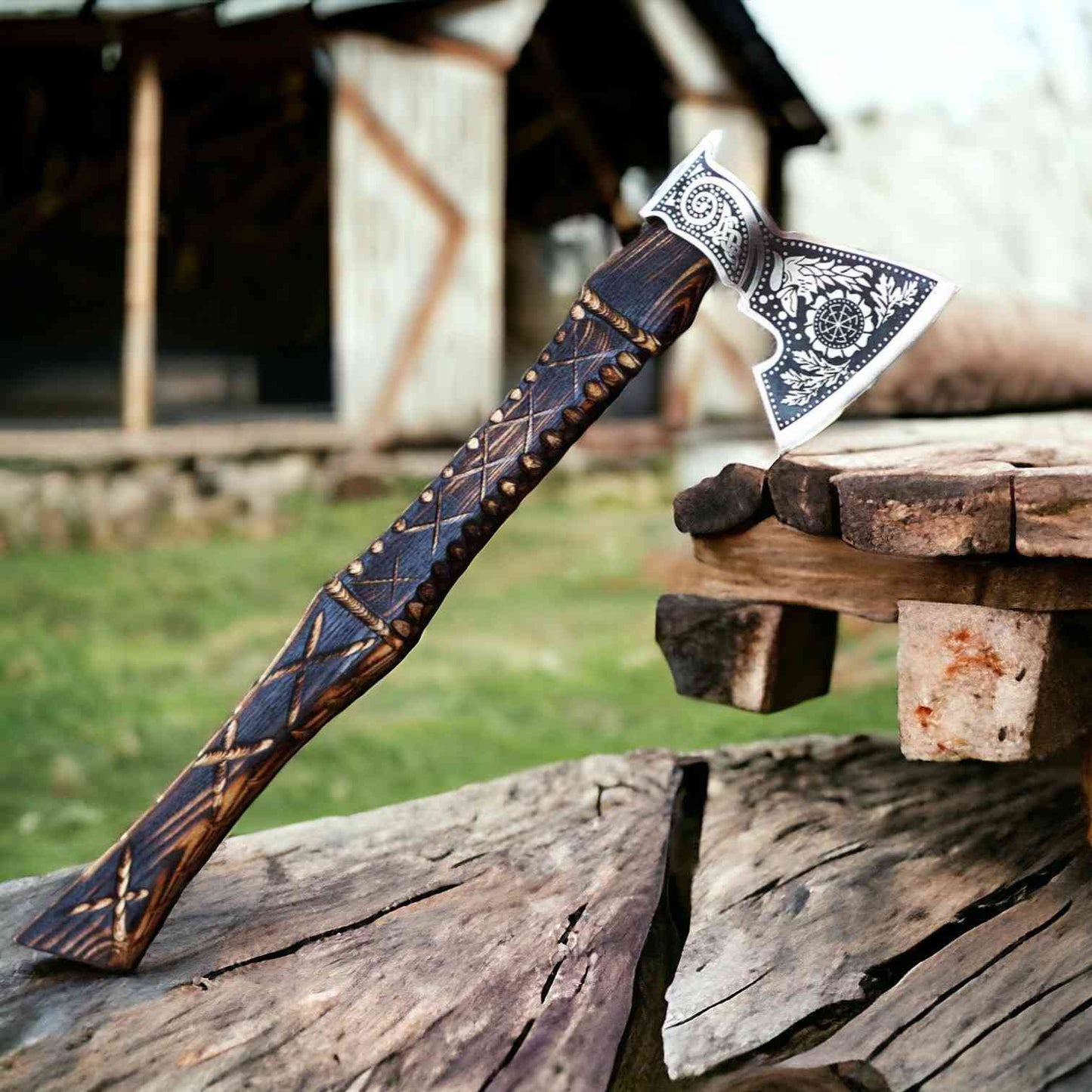 Carved ash handle of a Viking bearded axe with X-cross pattern and raven-engraved 1075 steel head