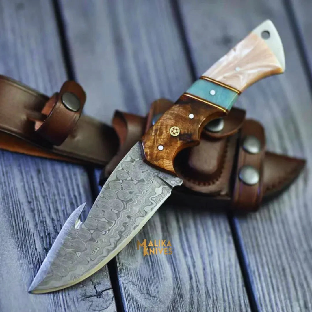 Damascus Gut Hook Knife with leather sheath.