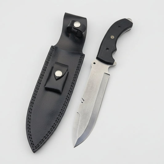 A custom spear-point Bowie knife with a G10 Micarta handle and a D2 steel blade, accompanied by a Black Cowhide leather sheath.