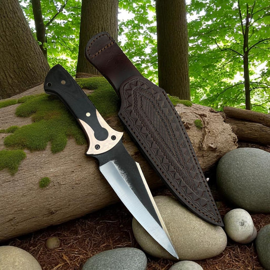 Full-tang 11-inch hunting knife with leather sheath on forest background