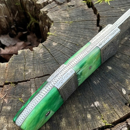 Hand engraved d2 hunting knife spine close up