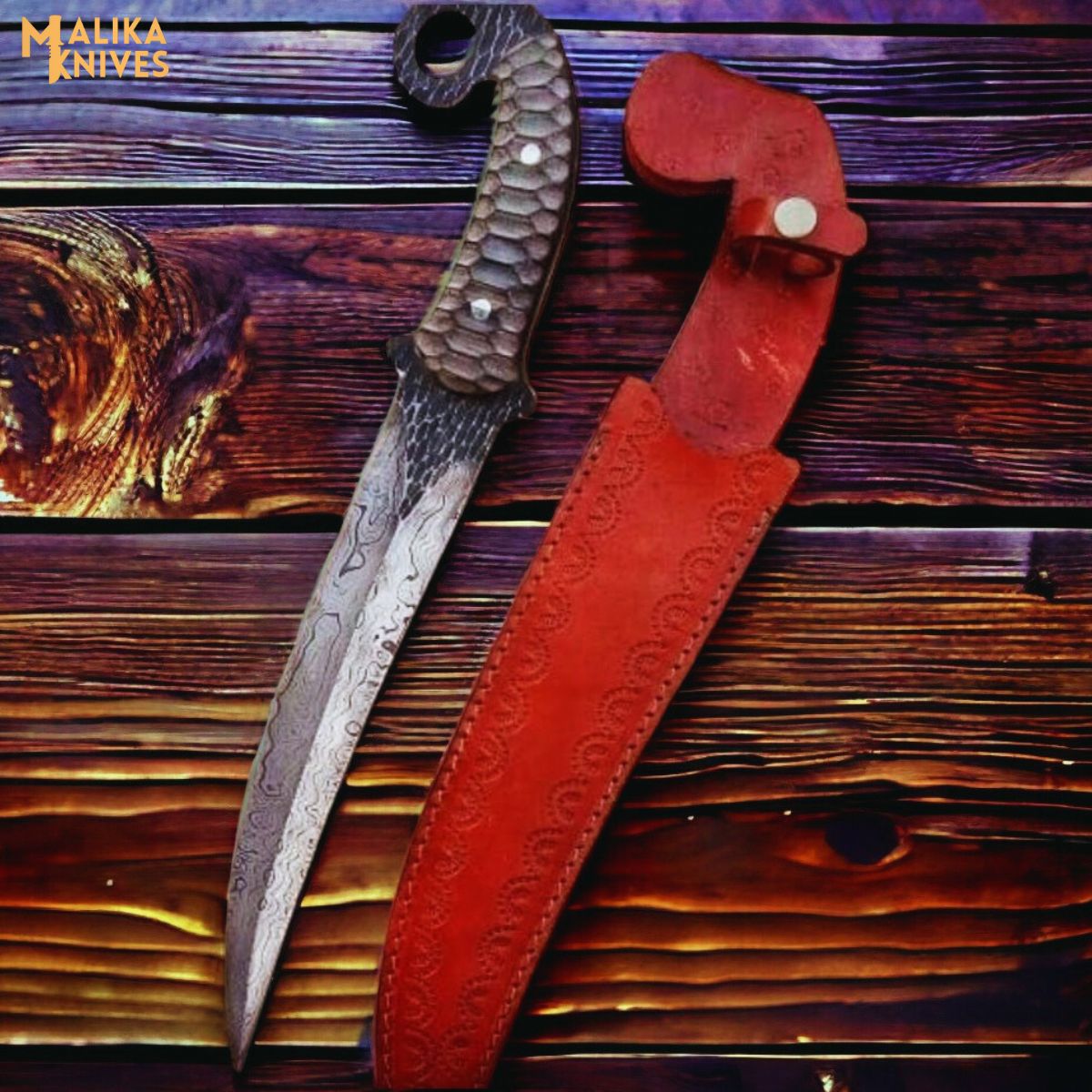 Hand forged Damascus Ringtail Hunting Knife Micarta handle and leather sheath on a wooden surface, brand 'Malika Knives' visible.