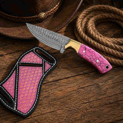 Turquoise Buckaroo Damascus knife with brass bolster and leather pancake sheath