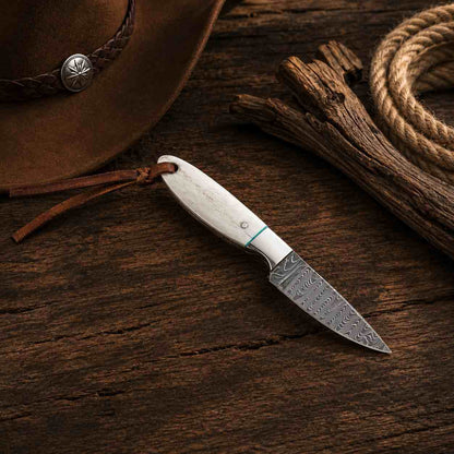 Western-style Buckaroo fixed blade knife crafted from Damascus steel with a polished camel bone handle