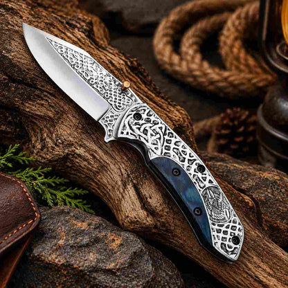 Acid etched Viking folding knife with D2 steel blade and engraved handle design
