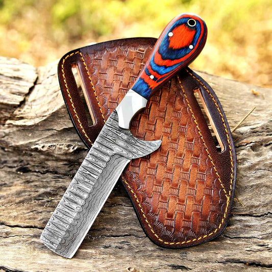 Handmade bull cutter knife with Damascus blade, pakka wood handle, and leather pancake sheath