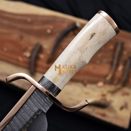 Camel bone handle closeup of copper damascus alamo musso bowie knife 