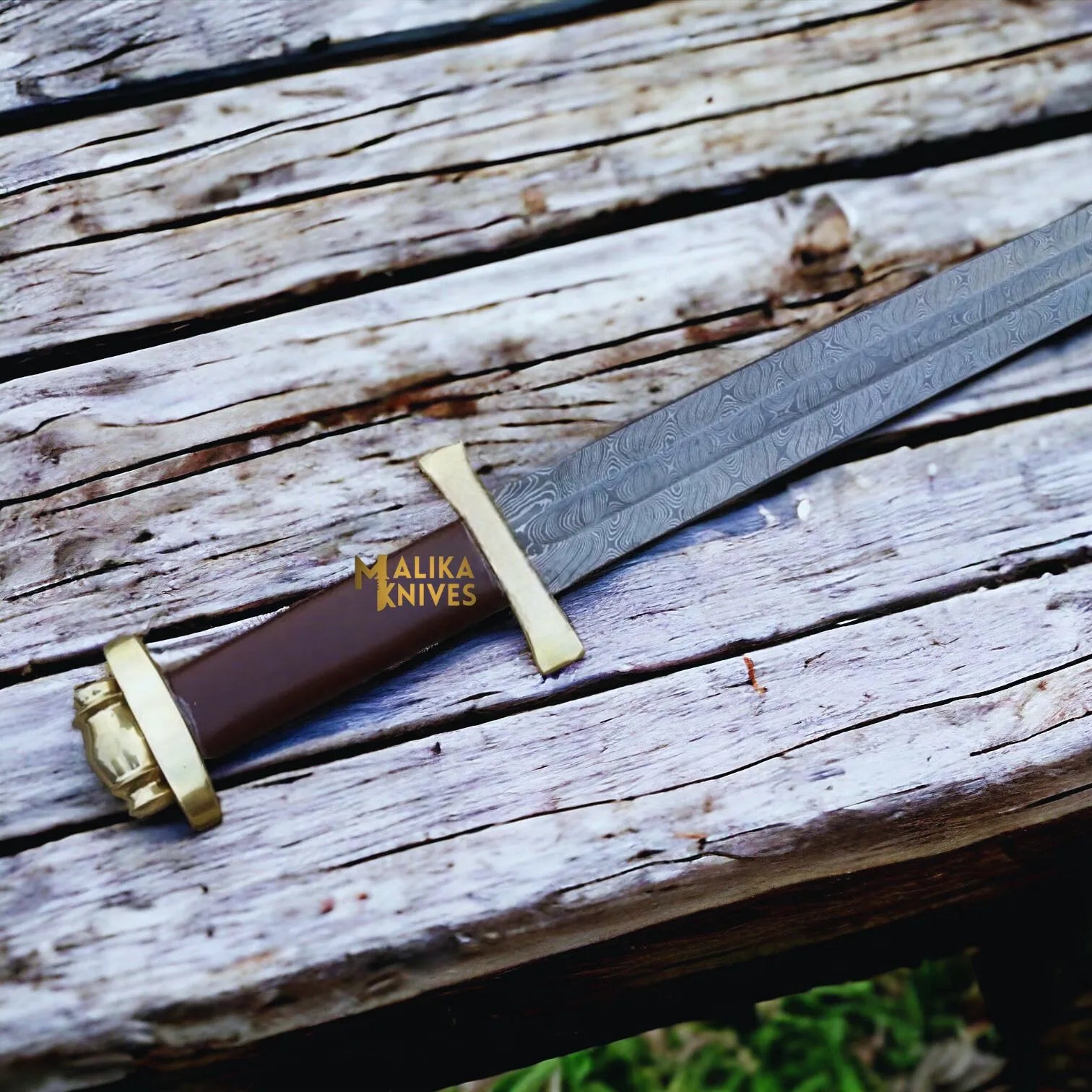 Close up Viking long sword with brass guard and pommel.