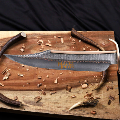 Blade closeup of copper damascus alamo musso bowie knife 