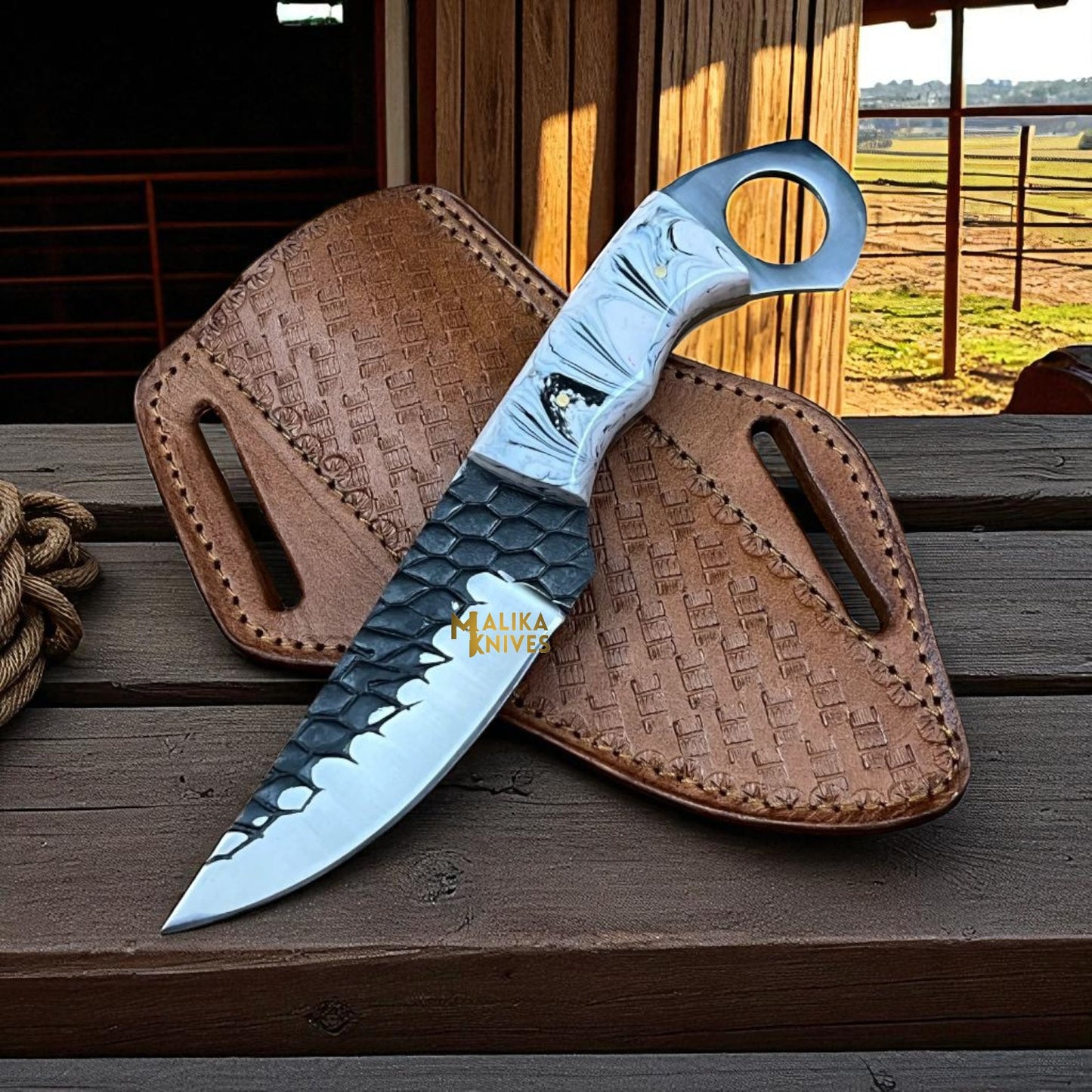 Handmade cowboy knife with forged D2 steel blade, resin handle, and leather pancake sheath, western ranch style.