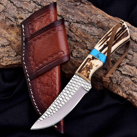 Handmade cowboy knife by Malika Knives with 5mm D2 steel blade, antler handle, turquoise spacer and leather sheath