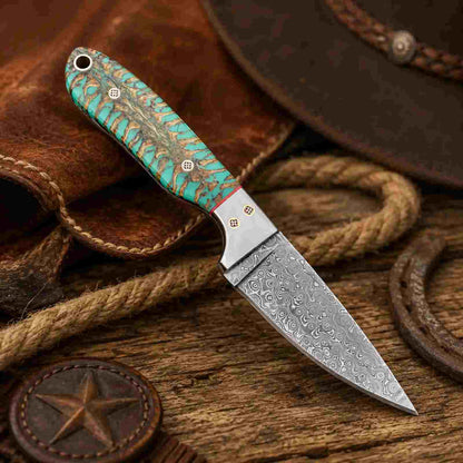 Buckaroo knife showing patterned Damascus steel blade and SS Masonic pin bolster