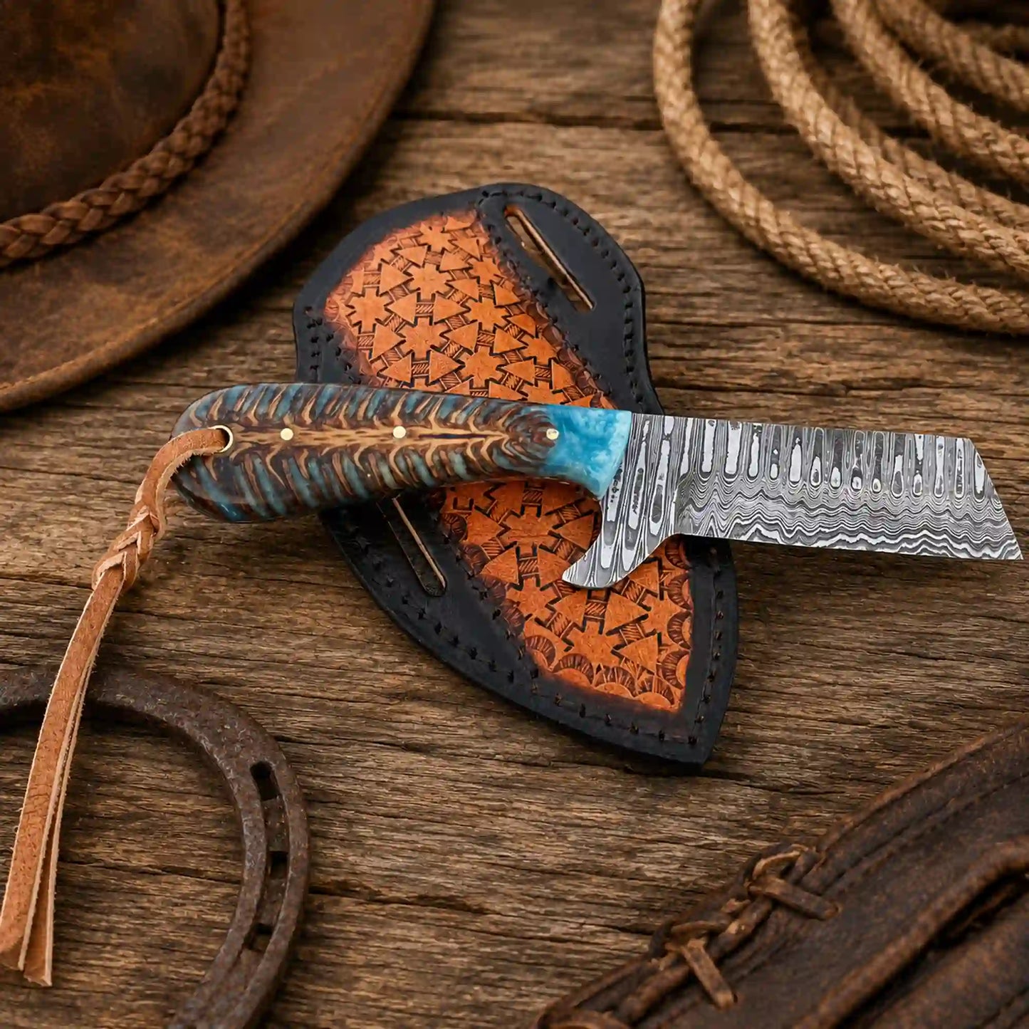 Damascus Bullcutter knife with pine cone handle and pancake leather sheath