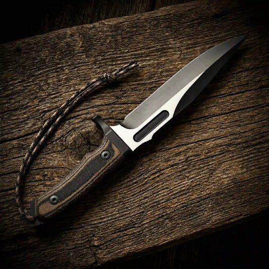 D2 spear-point survival bowie knife with G10 handle and paracord lanyard on wood