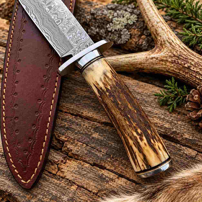 Handmade Damascus steel Bowie knife with stag antler handle and leather sheath
