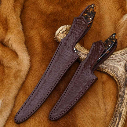 Fillet and boning knife set sheathed in matching tooled brown leather sheaths