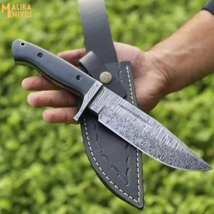Fire pattern Damascus hunting knife with G10 handle outdoor setup