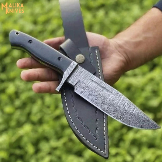Fire pattern Damascus hunting knife with G10 handle outdoor setup