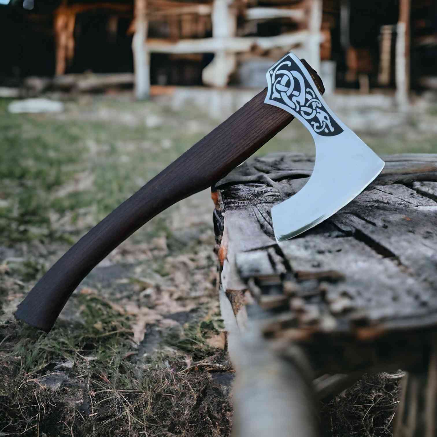 Hand-forged Viking serpent bearded axe with 1075 steel head and smooth rosewood handle on planks