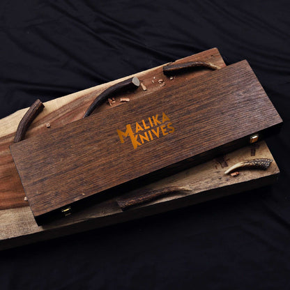 Wooden knife set with 'Malika Knives' branding on a dark background for Alamo Musso Bowie knife