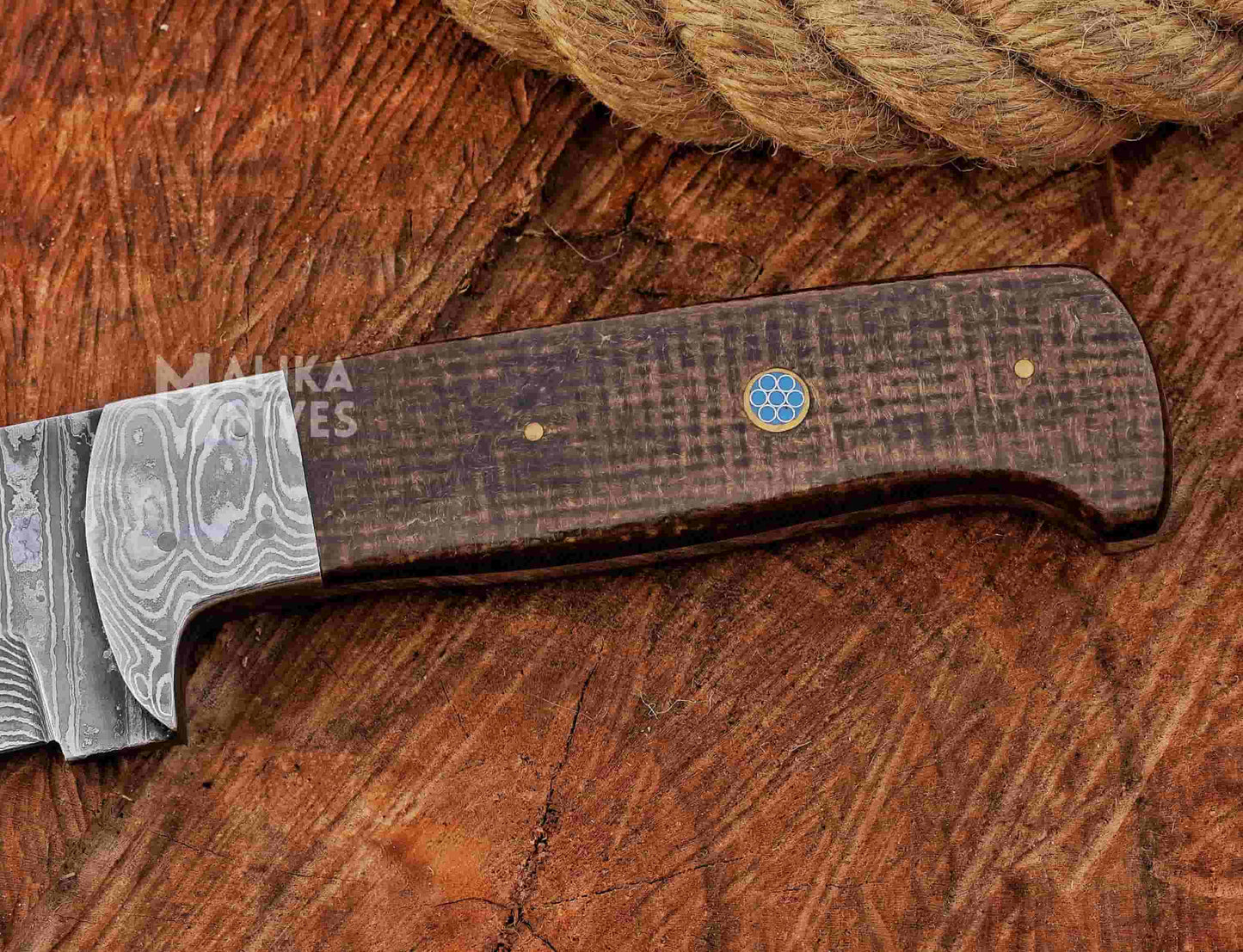 Handcrafted knife with a Micarta handle on a wooden surface