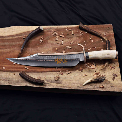 alamo musso bowie knife on wood surface full horizontal view