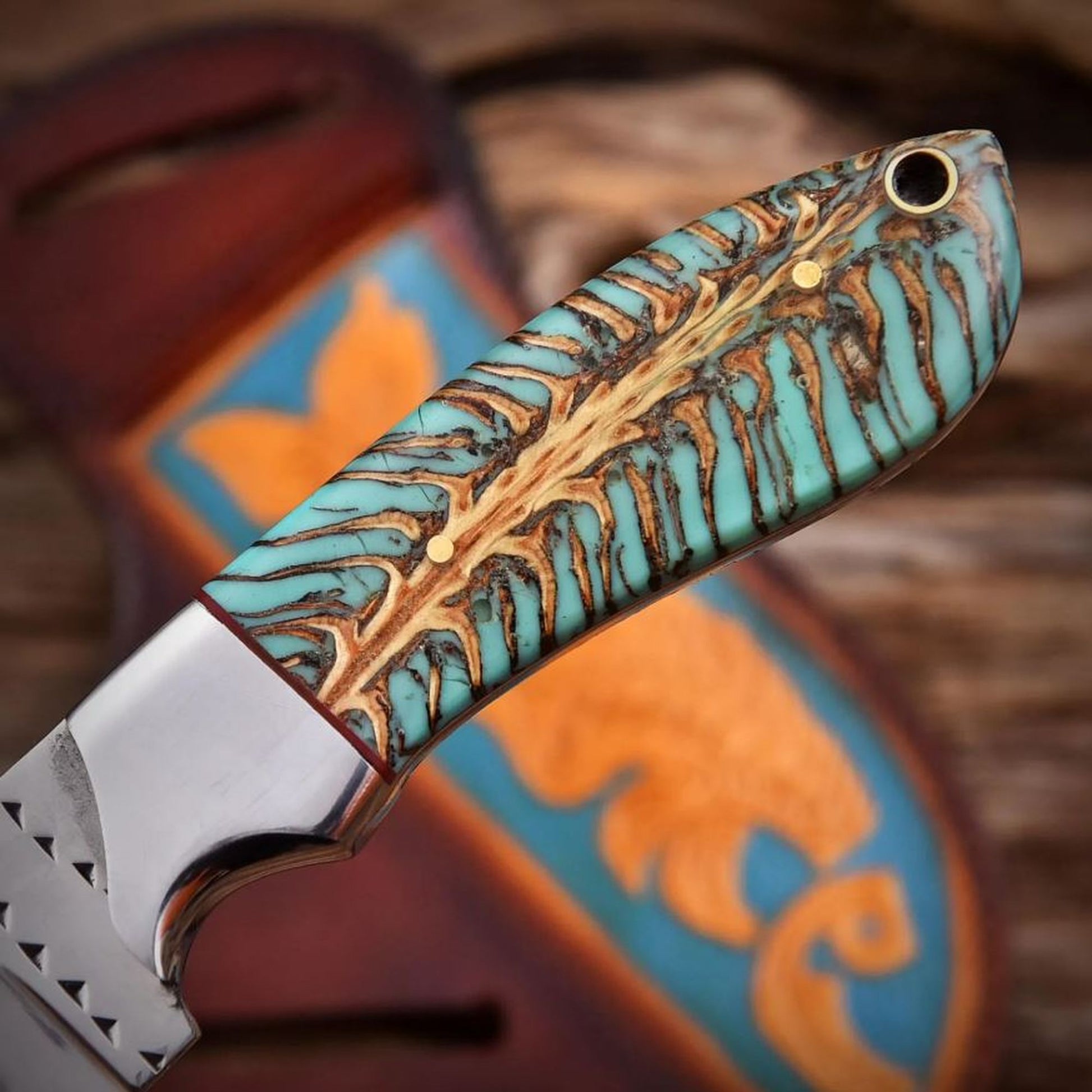 Pinecone resin handle close-up with steel bolster detail