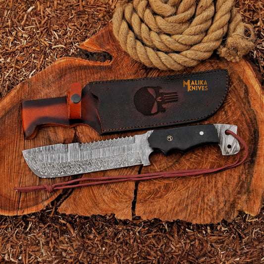 Front view of Punisher Bowie knife with Damascus steel fixed blade, black G10 handle, and custom leather sheath for hunting and bushcraft use.