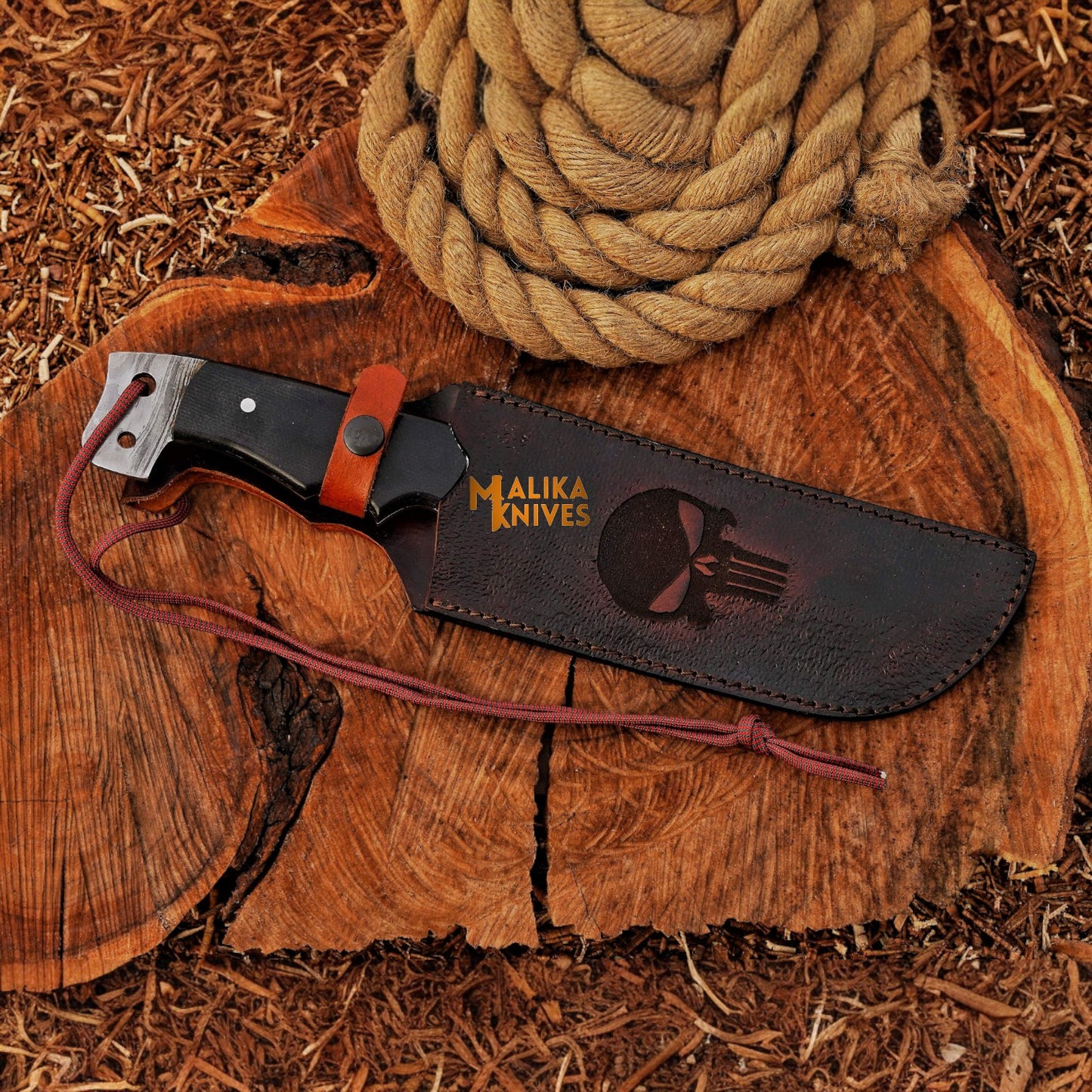 Punisher Bowie knife with Damascus steel blade and custom sheath displayed on wood background, ideal for bushcraft, survival, and hunting.