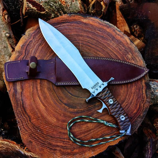 Last Blood Rambo Bowie Knife with a leather sheath on a wooden surface