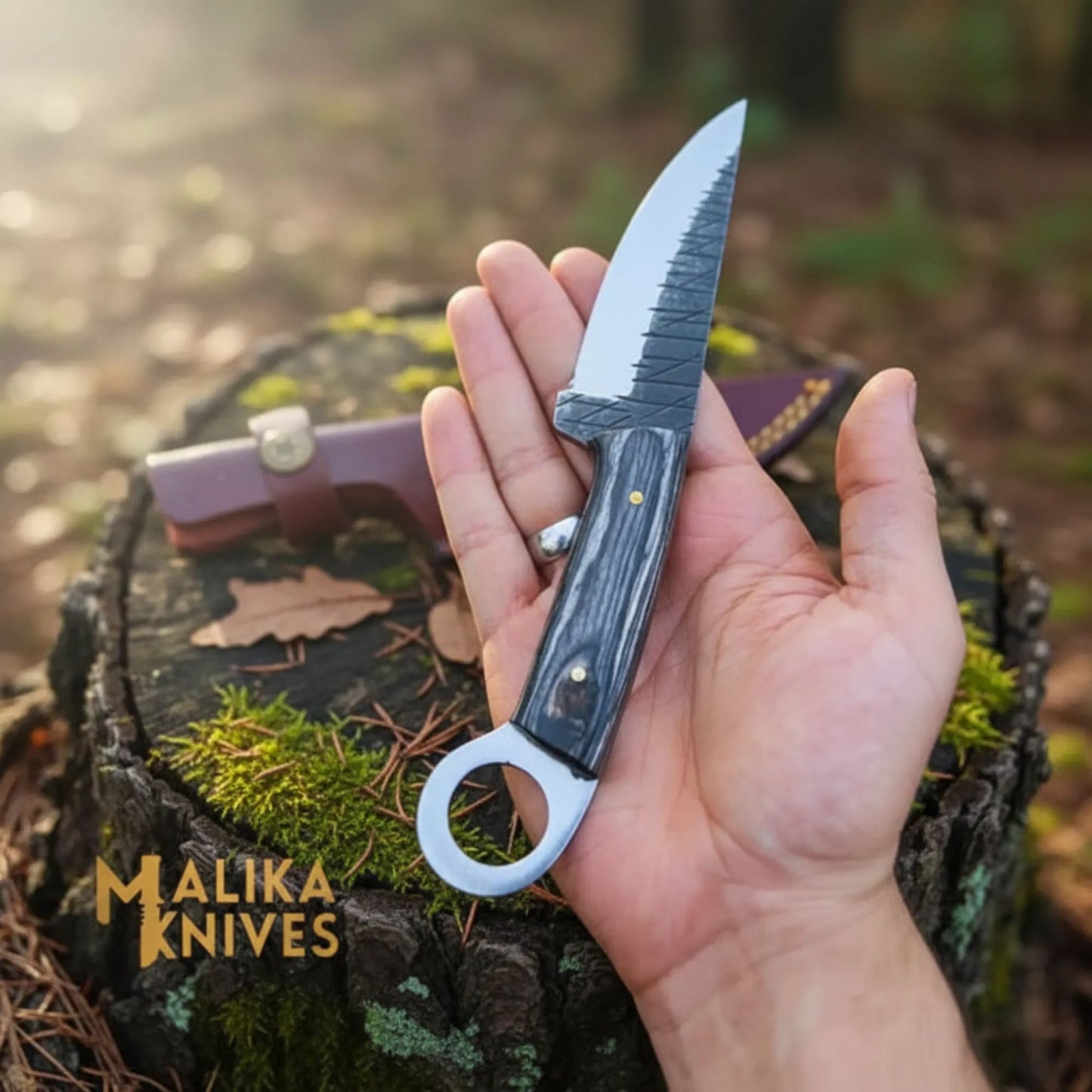 Hand holding ringtail hunting knife d2 steel blade pakka wood handle outdoor fixed blade knife