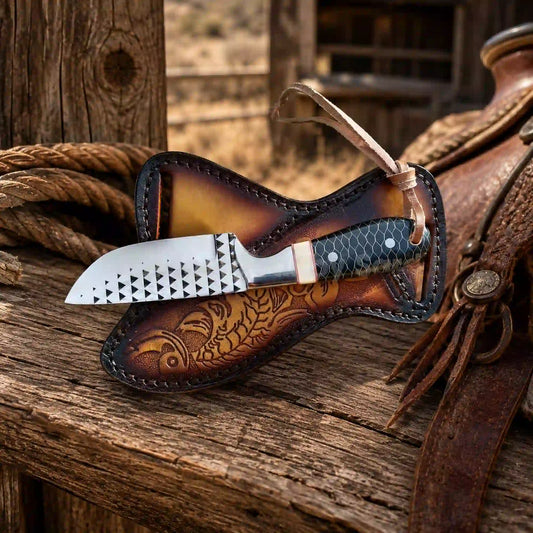 Camel bone buckaroo knife with tooled leather on wood