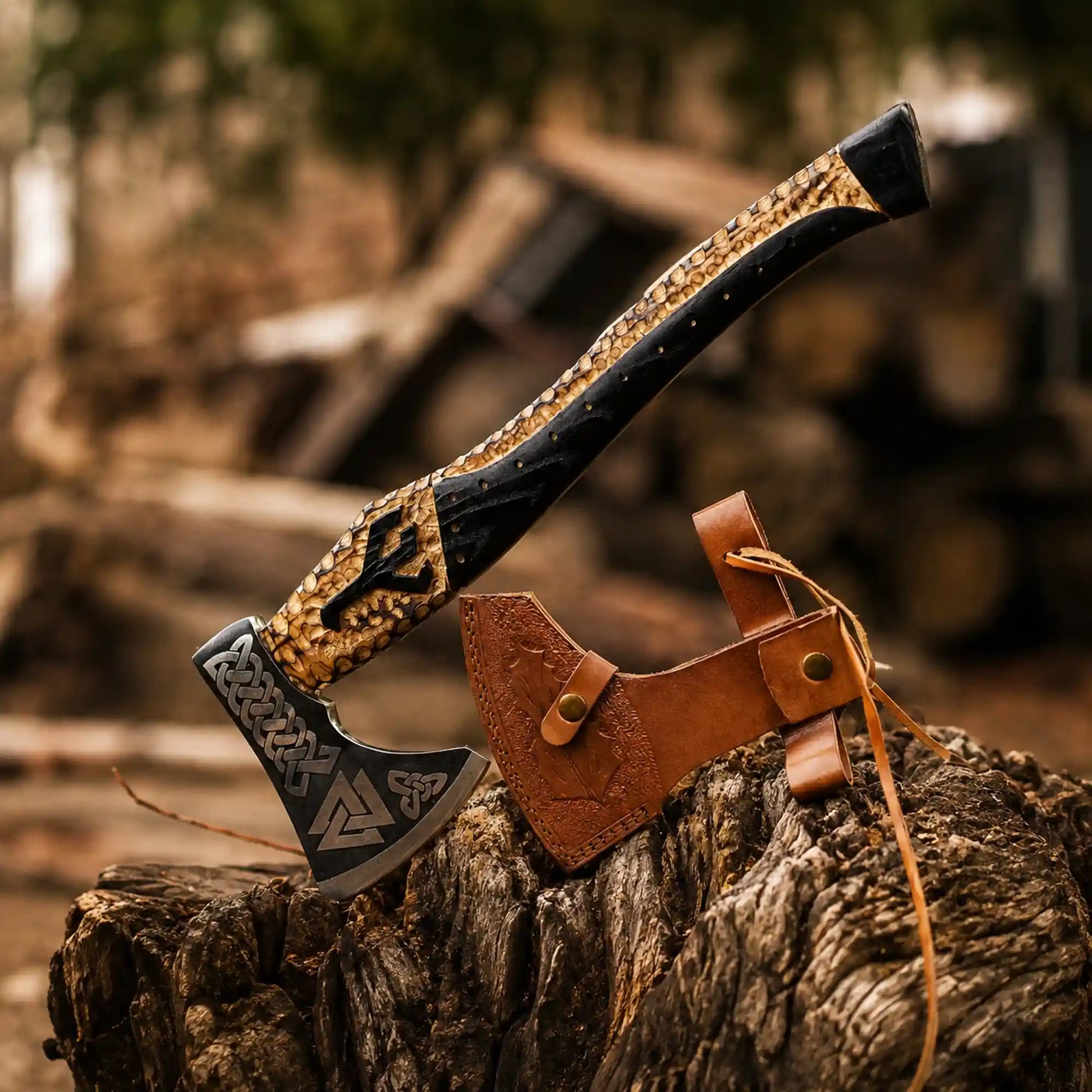 Hand-forged Valknut Viking axe with 1075 steel head, carved ash handle and tooled brown leather sheath
