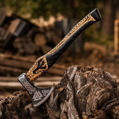 Close-up of Viking axe head showing Valknut, triquetra and knotwork engraving on 1075 steel
