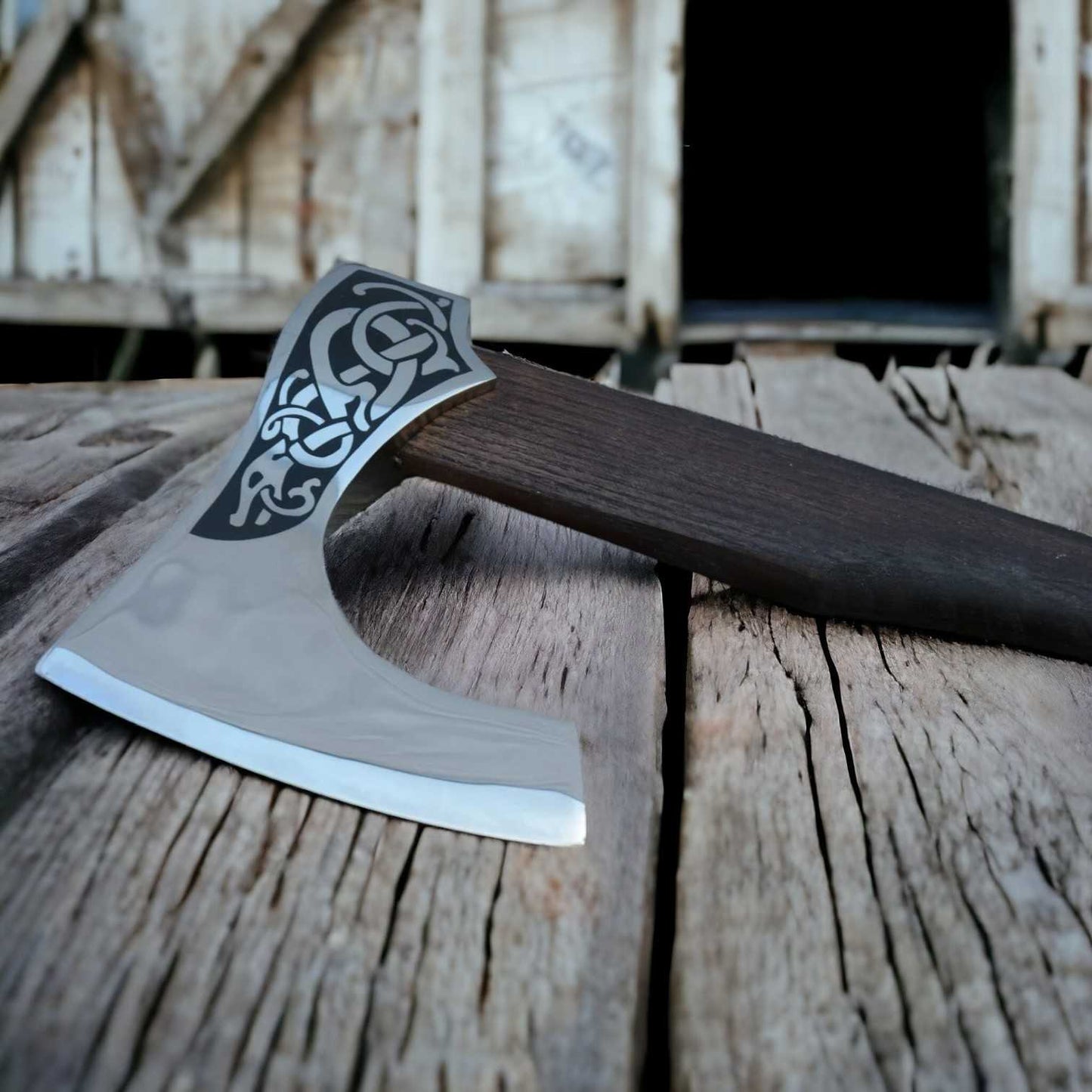 Viking bearded axe with Norse serpent engraved head and rosewood handle standing on a stump