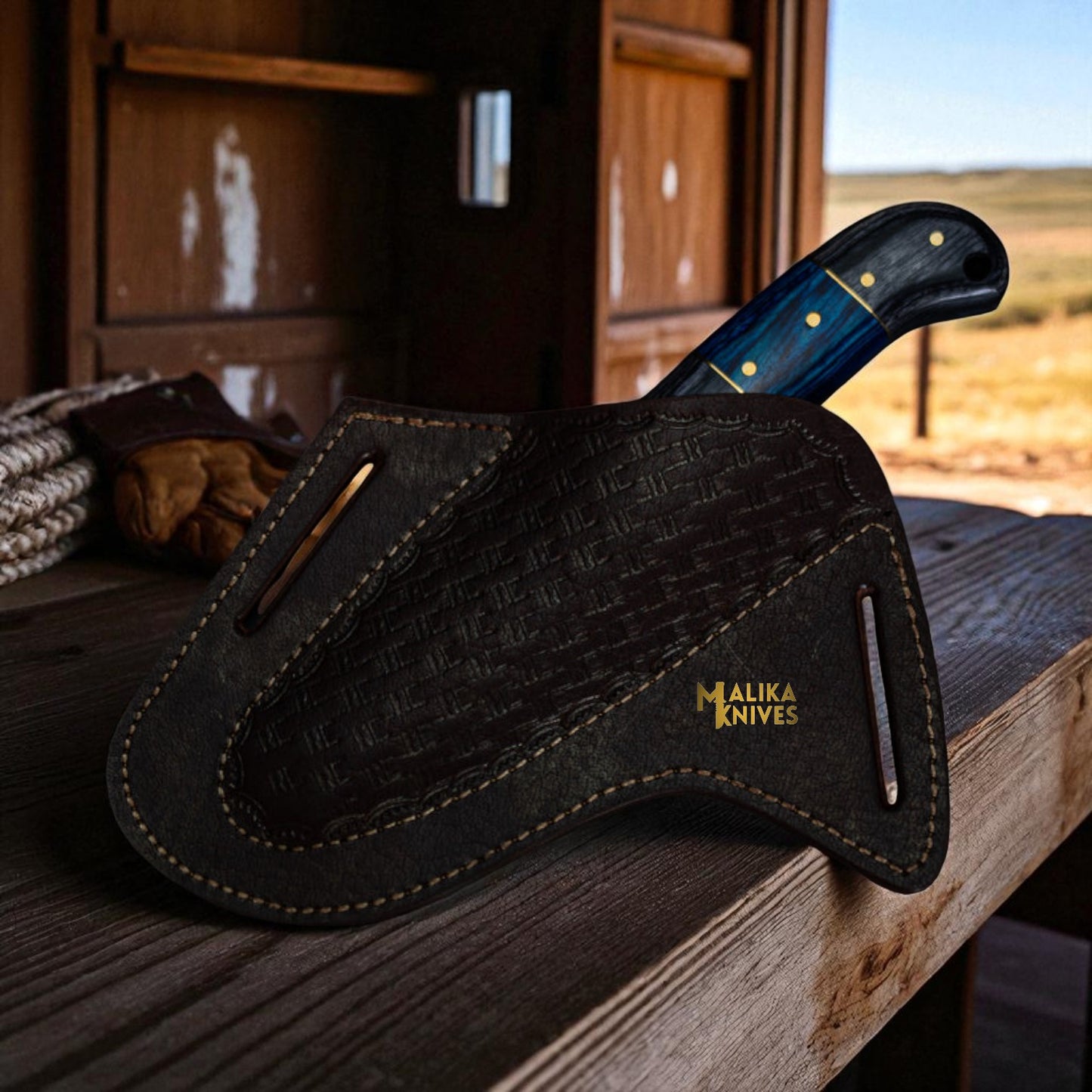 Western style bull cutter knife inside embossed leather sheath for ranch carry